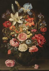 A Still Life of Lilies, Roses, Iris, Pansies, Columbine, Love in a Mist, Larkspur and Other Flowers in a Glass Vase on a Table Top, Flanked by a Rose and a Carnation - Clara Peeters